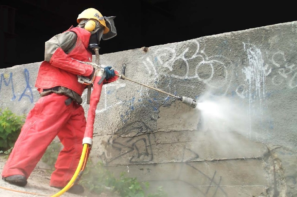 用“高压水枪”清除窑尾上升烟道等处结皮技术与应用